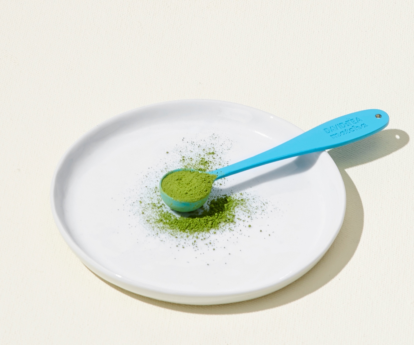 A perfect spoon filled with matcha powder.